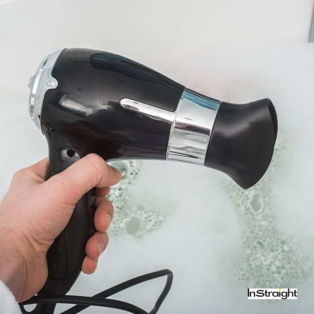 hand holding A Hair Dryer